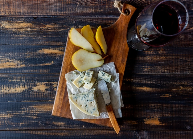 Cheese platter with blue cheese and pear. Wine snack. Italian cuisine. Vegetarian food. Healthy eating.