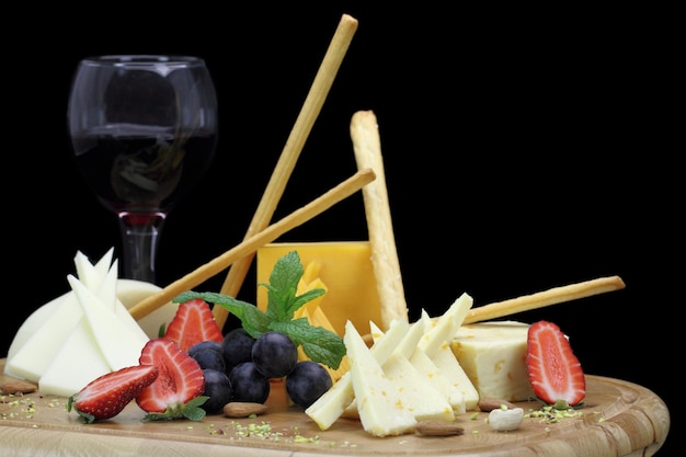 Cheese platter with fruits and nuts