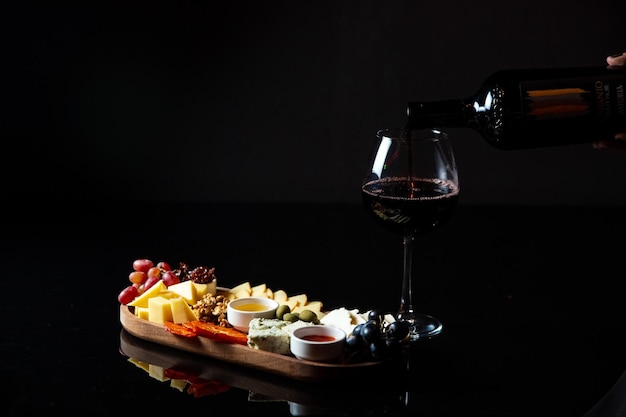 Cheese platter with snacks for wine