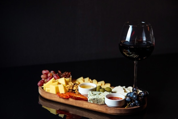 Cheese platter with snacks for wine