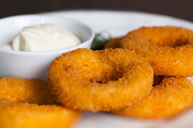 Cheese rings with cheese sauce with spices