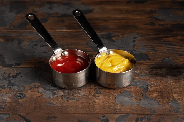 Cheese sauce mustard sour cream tomato sweet and sour sauce on a wooden background