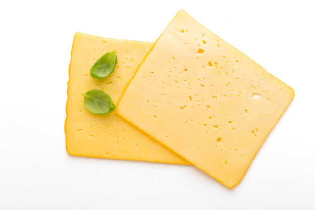 Cheese slice isolated on the white table