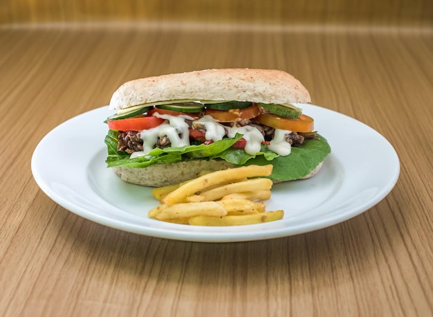 Cheese steak sandwich accompanied by fries