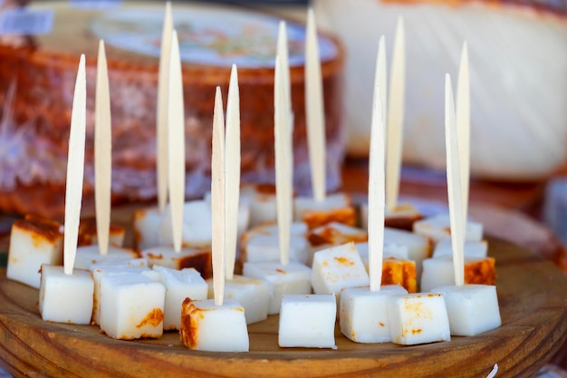 Cheese sticks on a tray with a cheese stick in the middle.