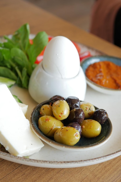 Cheese tomato and olive on a plate