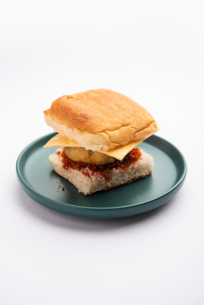 Cheese Vada pav or Grated cheese Wada Pao, popular Bombay snack food