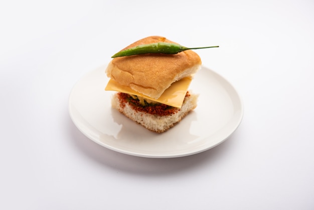 Cheese Vada pav or Grated cheese Wada Pao, popular Bombay snack food