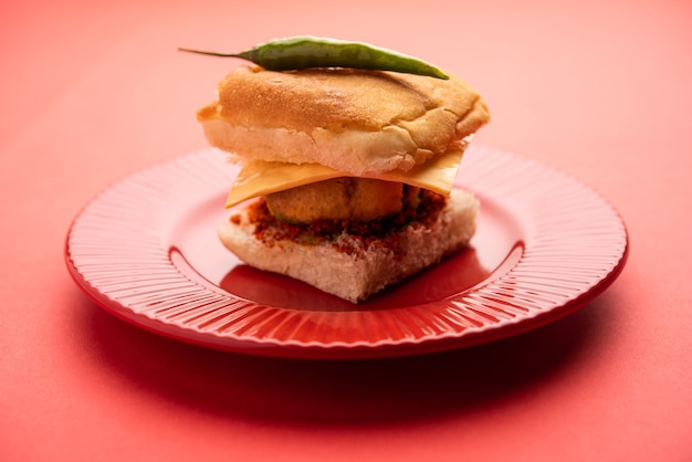 Cheese Vada pav or Grated cheese Wada Pao, popular Bombay snack food