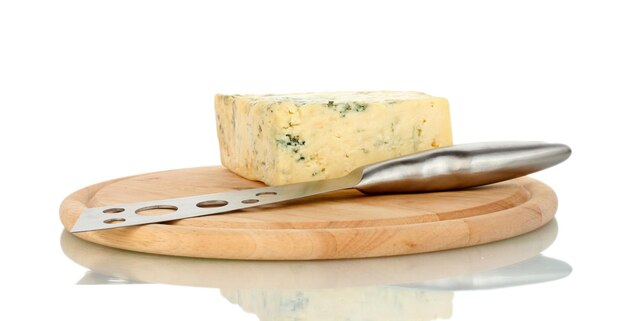 Cheese with mold and knife on the cutting board isolated on white background