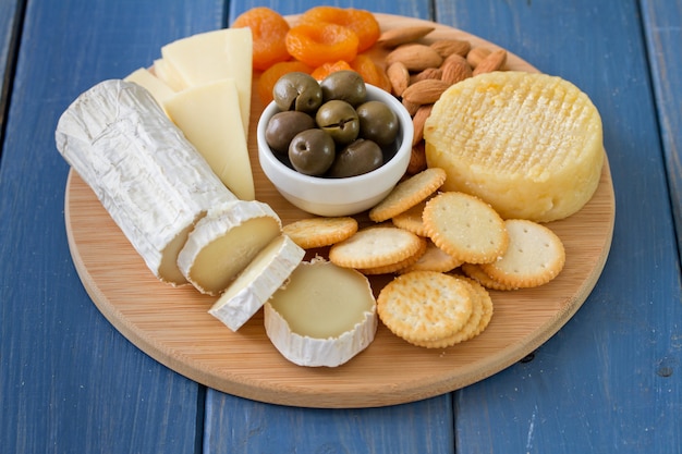 Cheese with olives, dry fruits and cookies