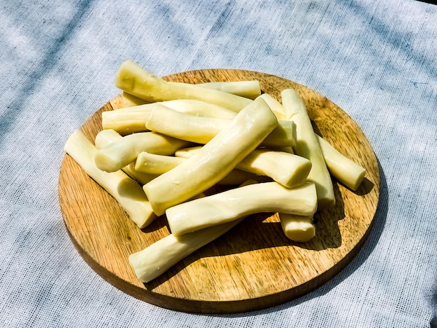 Cheese on a wooden board Background Georgian cheese suluguni