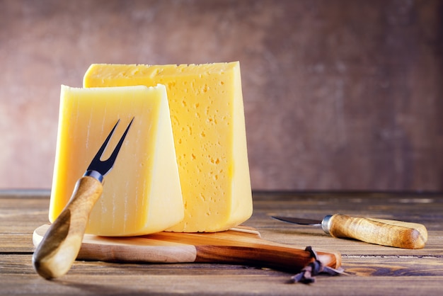 Cheese On Wooden Kitchen Board. Natural Healthy Food.