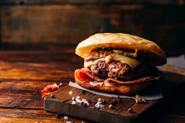 Cheeseburger on cutting board