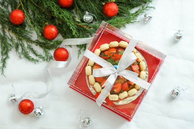 Cheesecake served with Christmas decorations.