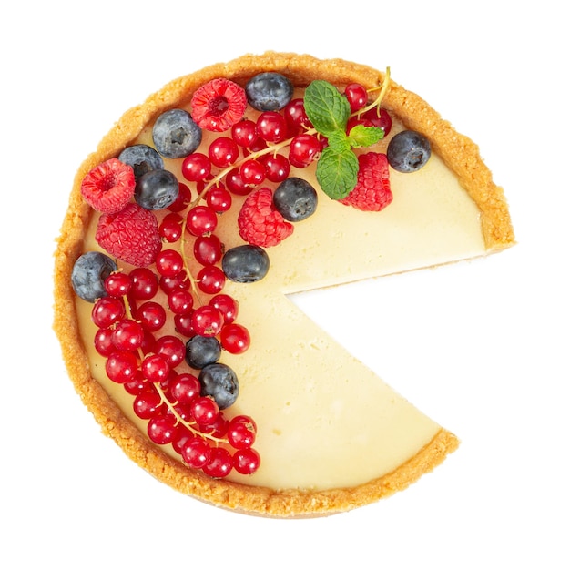 Cheesecake with fresh red currants blueberries raspberries and mint leaves isolated on white background Top view