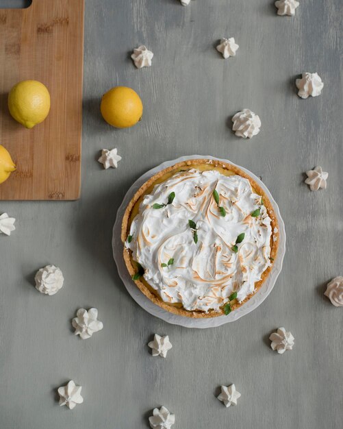 Cheesecake with lemons on the table