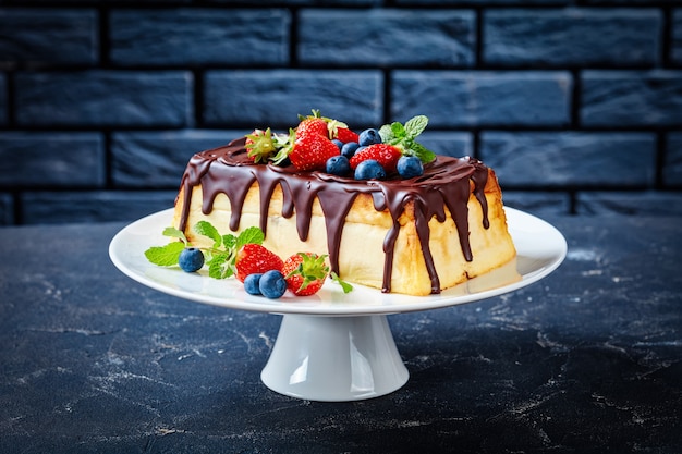 Cheesecake with mint and strawberries on a plate