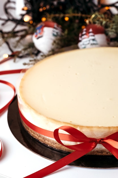 cheesecake with red ribbon.