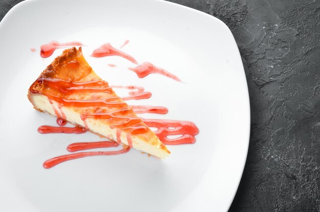 Cheesecake with strawberry sauce Top view Free space for your text