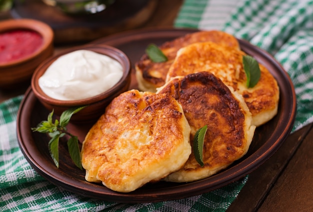 Cheesecakes with mint and sour cream. Breakfast.