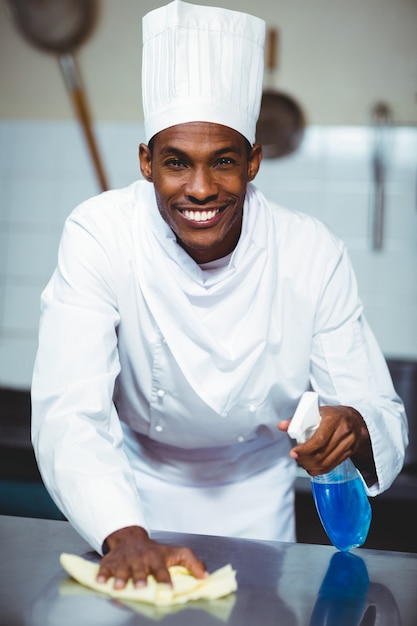 Chef cleaning kitchen counter