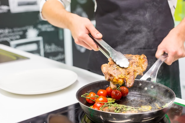 Chef cooking meat