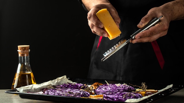 Chef cooking traditional German dish of red cabbage baked with nuts quince and apples Vegan roasted red cabbage steaks Food recipe background