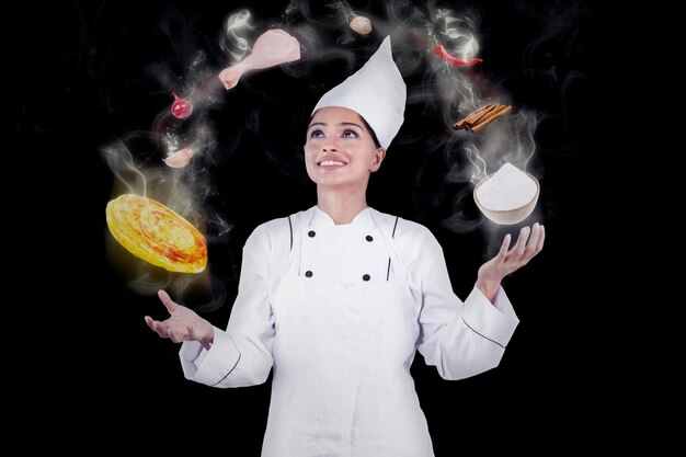 Photo chef cooking with magic while wearing uniform