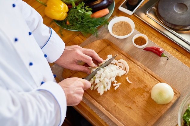 Chef Cutting Onion