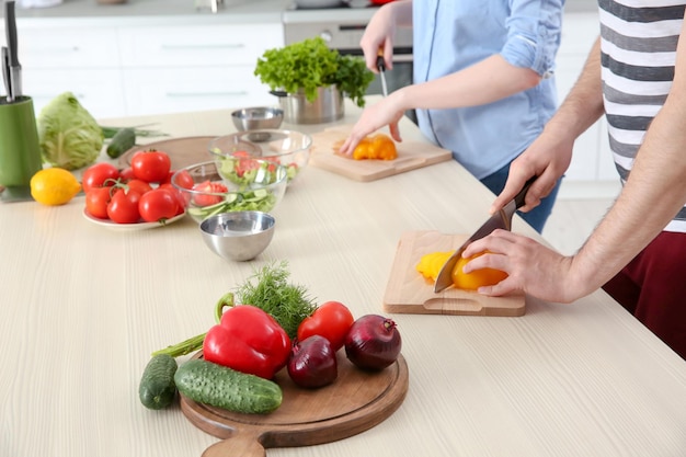 Chef giving cooking classes in kitchen