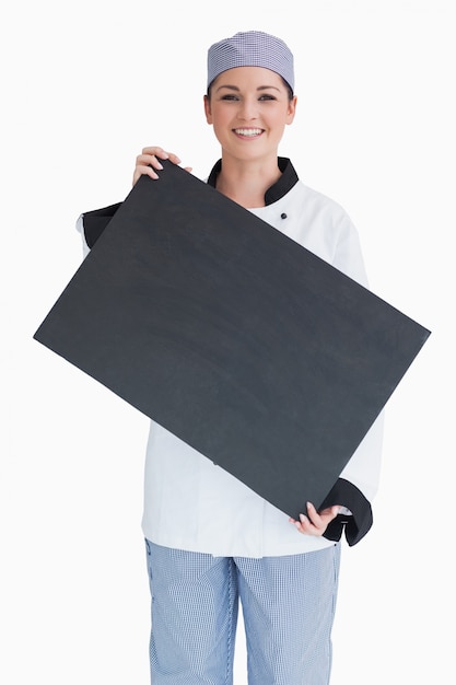 Chef holding blackboard