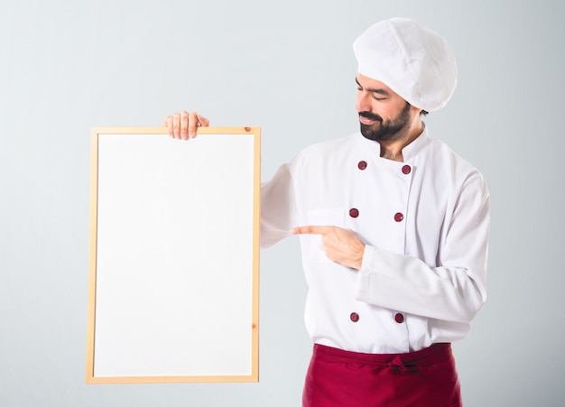 Chef holding empty placard