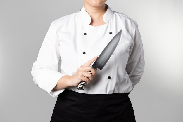 Photo chef holding knife in white background isolated