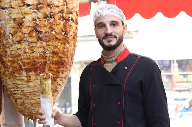 Chef Holding Shawarma Roll Spinning Grillers and Meat Photos