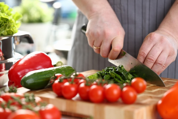 Chef-kok hands chopping dieting herb greens ingredient