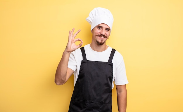 Chef man feeling happy showing approval with okay gesture