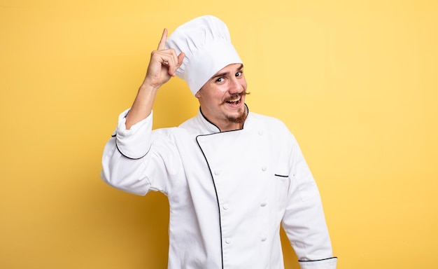 Chef man feeling like a happy and excited genius after realizing an idea