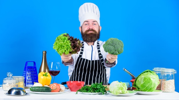 Chef man in hat Secret taste recipe Dieting and organic food vitamin Vegetarian Street food Mature chef with beard Healthy food cooking Bearded man cook in kitchen culinary