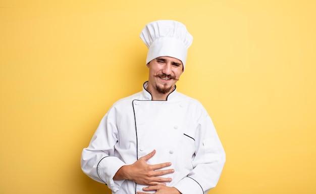 Chef man laughing out loud at some hilarious joke