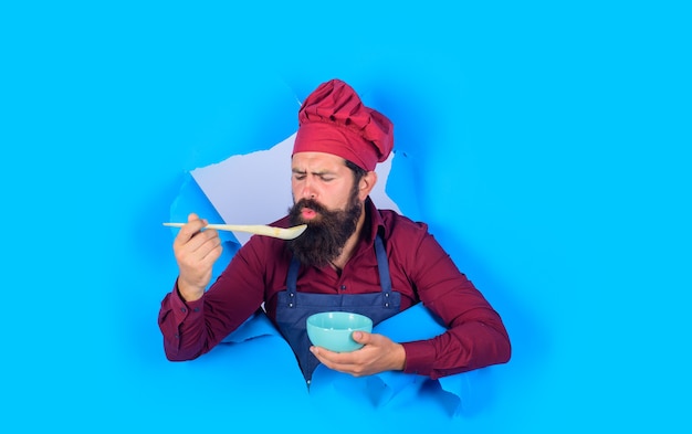 Chef man in uniform chef man holds wooden spoon healthy food eat healthy cook preparing food healthy