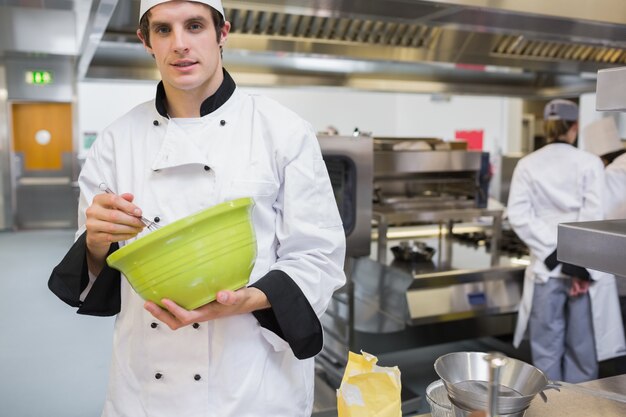 Photo chef mixing in the kitchen