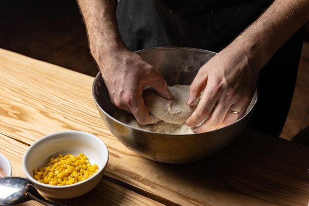 the chef prepares delicious pizza in the restaurant. Close-up