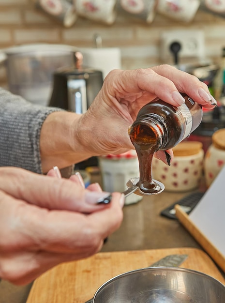 Chef prepares pie syrup in a metal bowl in the kitchen