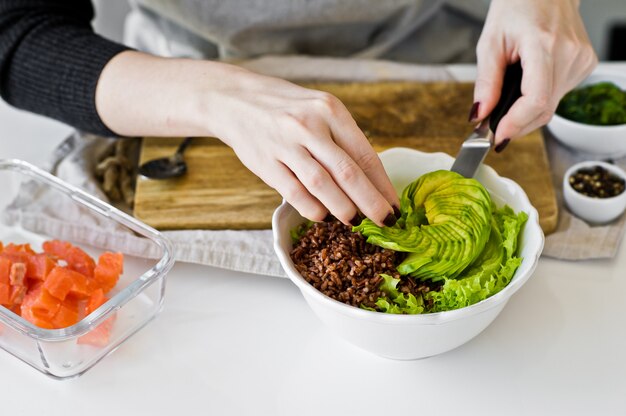 The chef prepares a Poke bowl. 