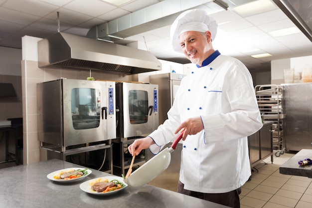 Chef preparing a dish in his kitchen