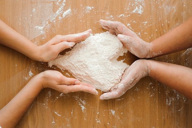 Chef preparing dough - cooking process, flour heart.