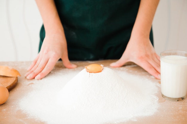 Chef preparing dough. cooking process, work with flour