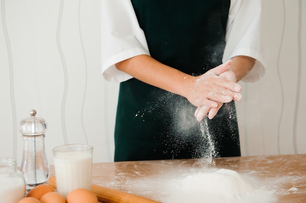 Chef preparing dough. cooking process, work with flour.