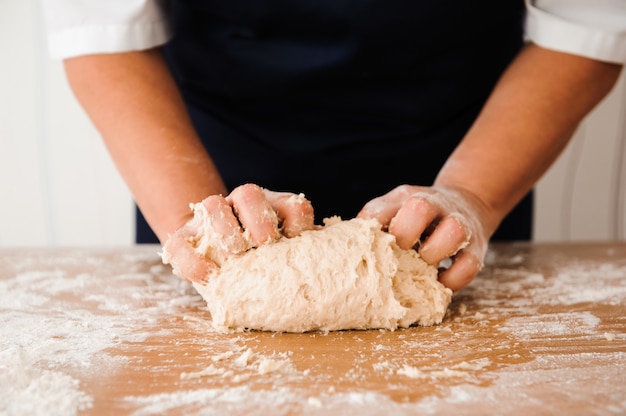 Chef preparing dough. cooking process, work with flour. 